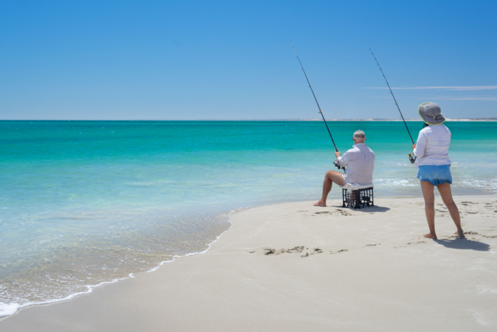 https://www.harvesttours.com.au/wp-content/uploads/2023/10/A-couple-fishing-on-a-sunny-day.jpg